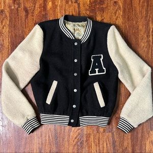 Sherpa Varsity Jacket . Cream and black with leopard satin lining.